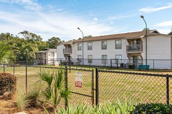 leash-free pet park and building exteriorat 701 South Apartments in Mobile, AL